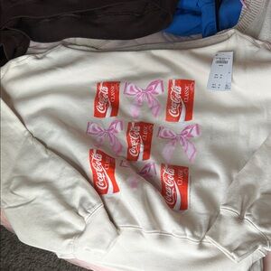 Coca-Cola Cream Sweatshirt with Red Cans and Pink Bows